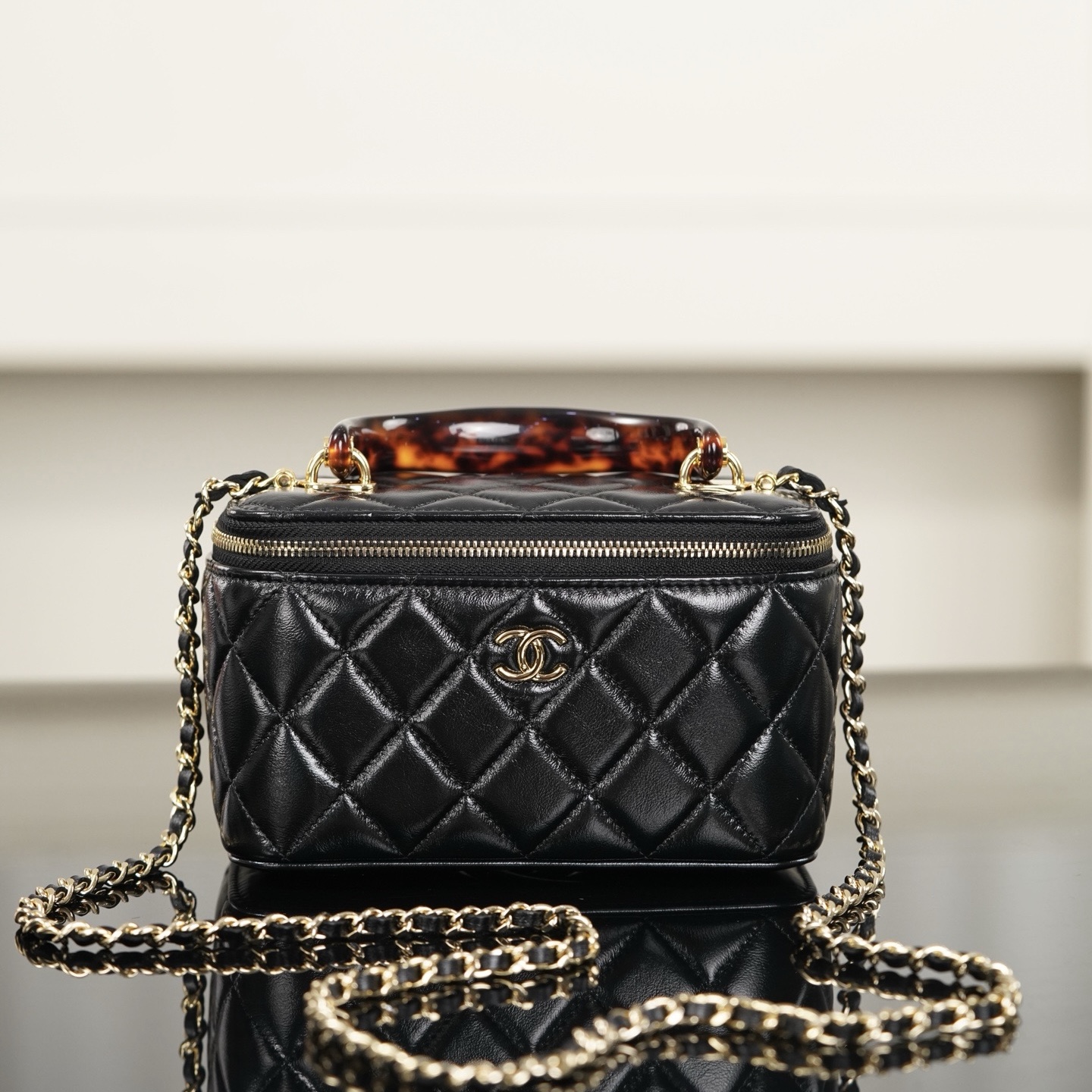 Chanel vanity case black quilted lambskin tortoise handle chain bag