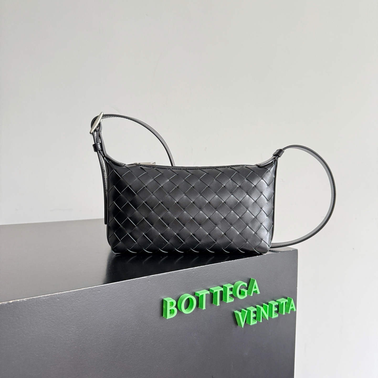 Bottega Veneta Traveler black calfskin woven phone bag