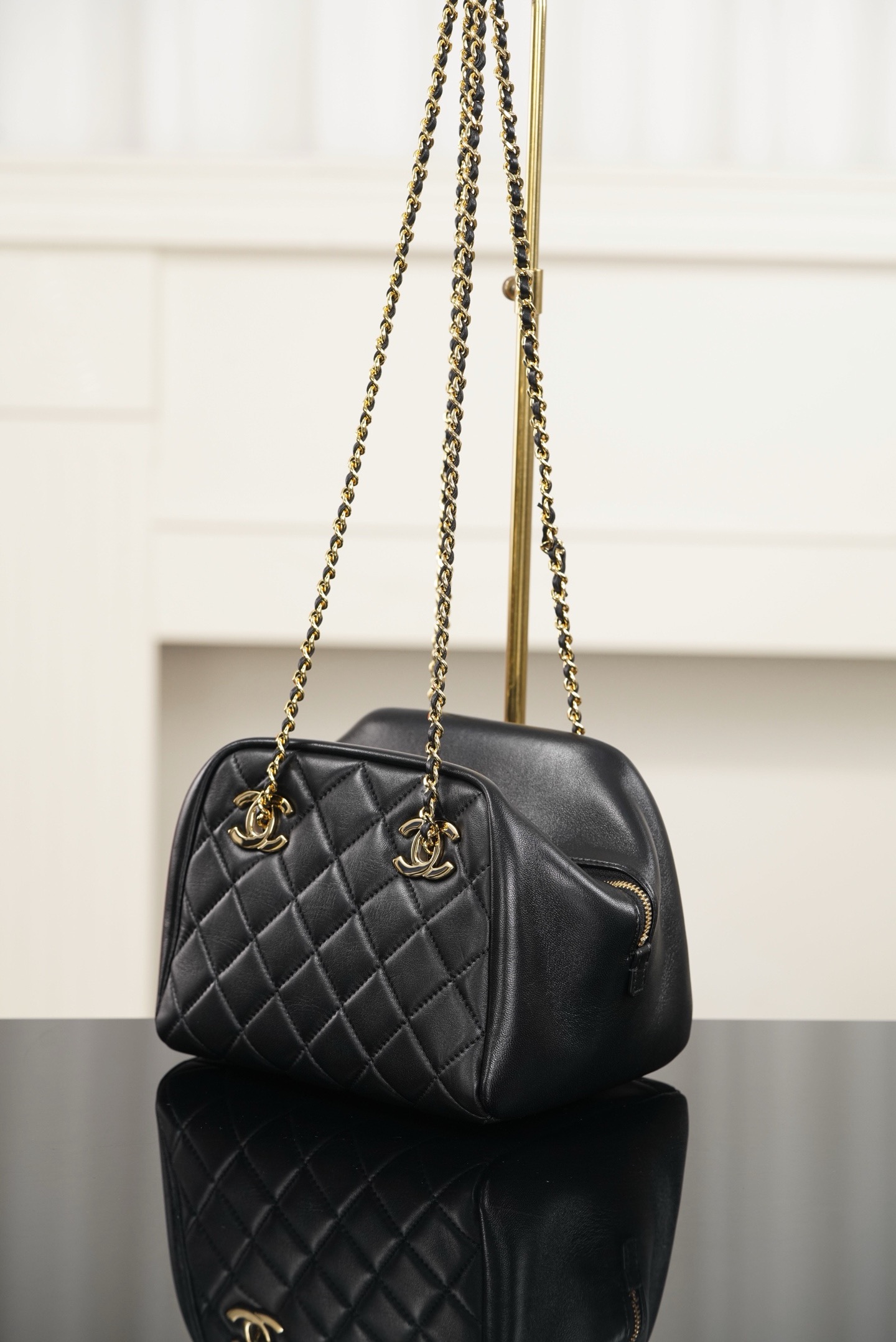 Chanel black gold quilted lambskin mini bowling bag