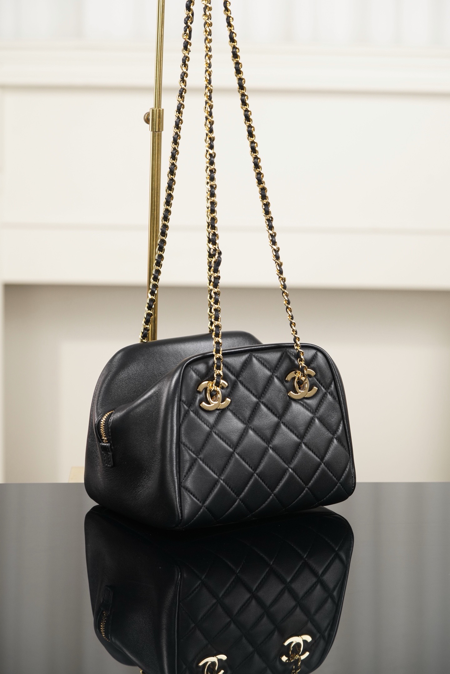 Chanel black gold quilted lambskin mini bowling bag