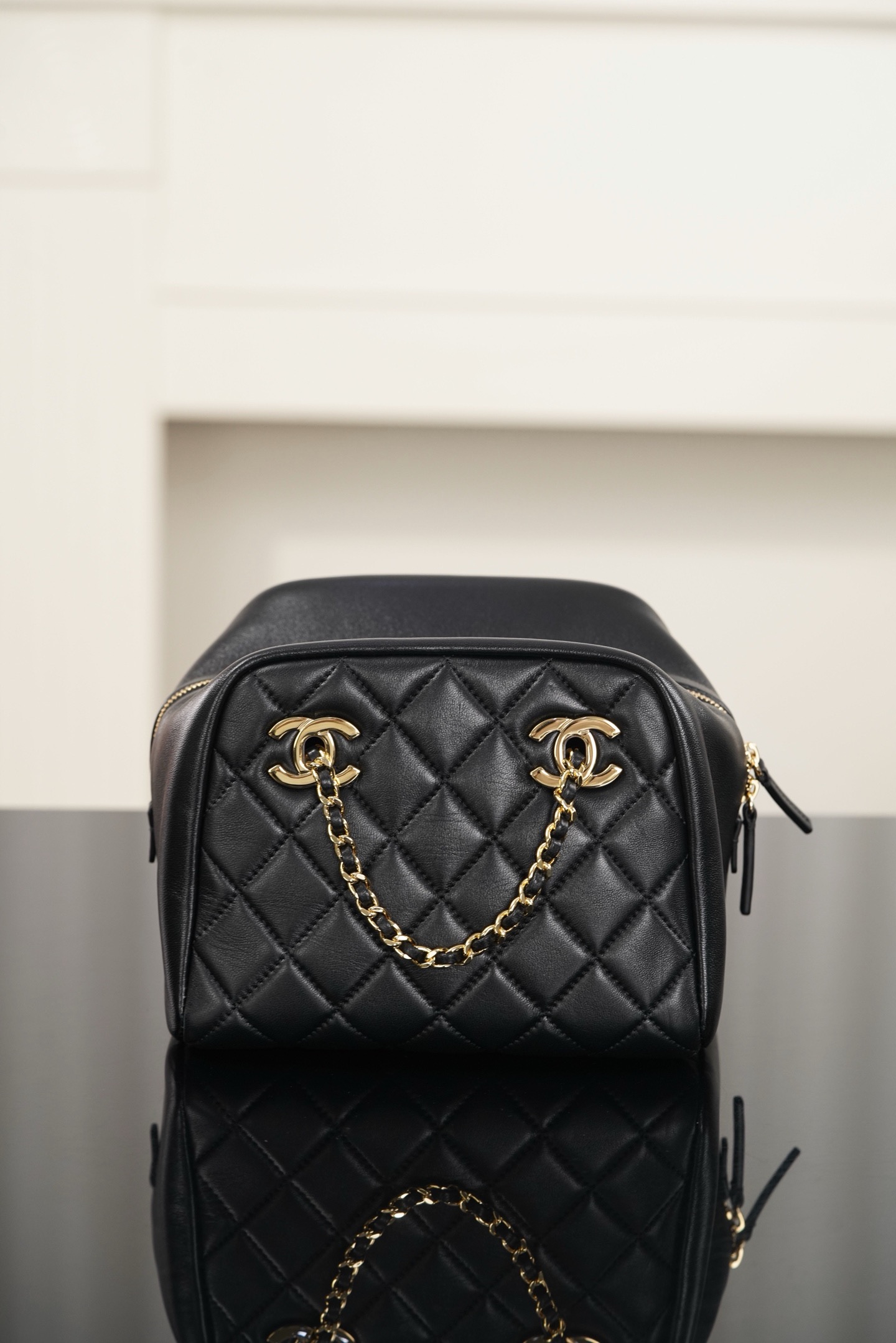 Chanel black gold quilted lambskin mini bowling bag