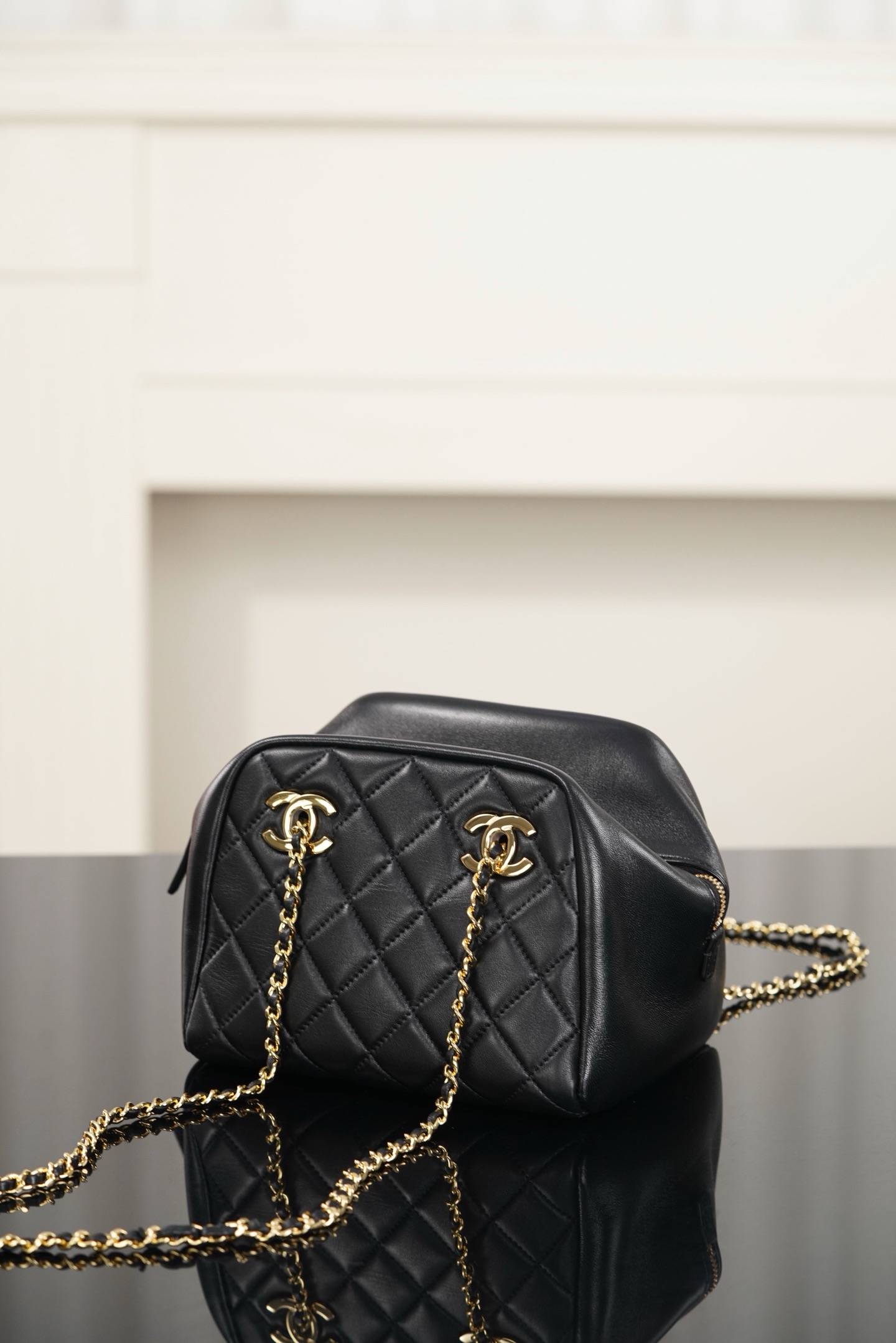 Chanel black gold quilted lambskin mini bowling bag