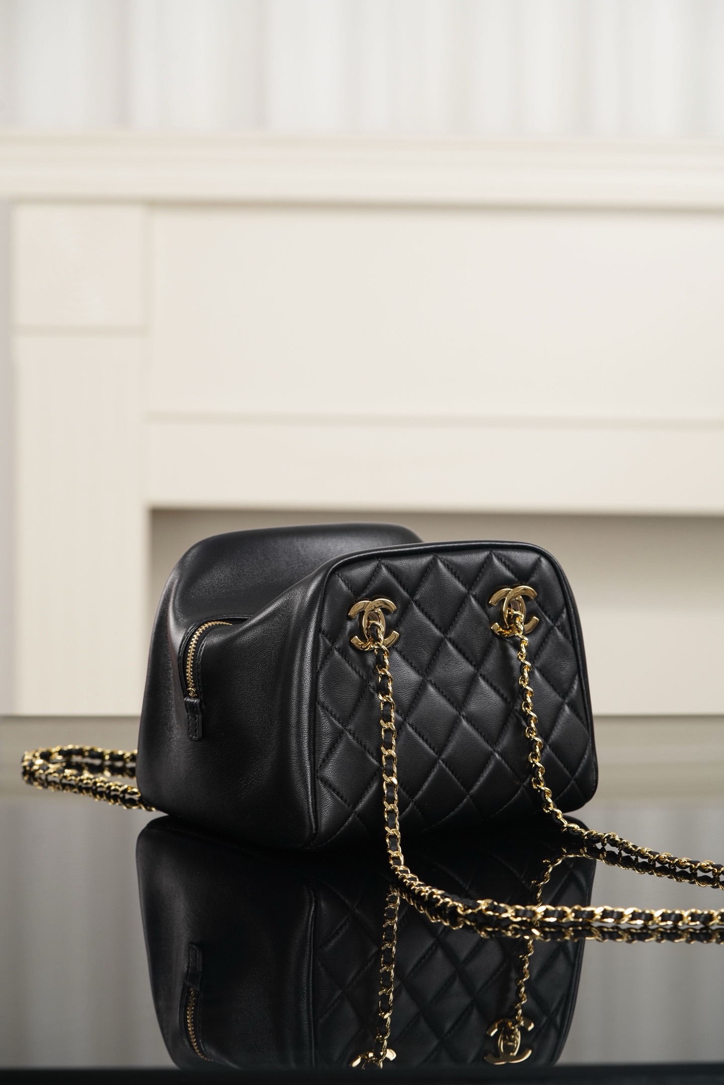 Chanel black gold quilted lambskin mini bowling bag