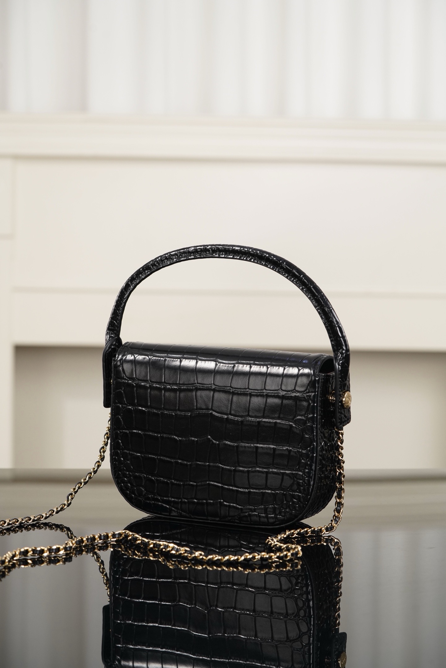 Chanel 26A black crocodile embossed top handle bag