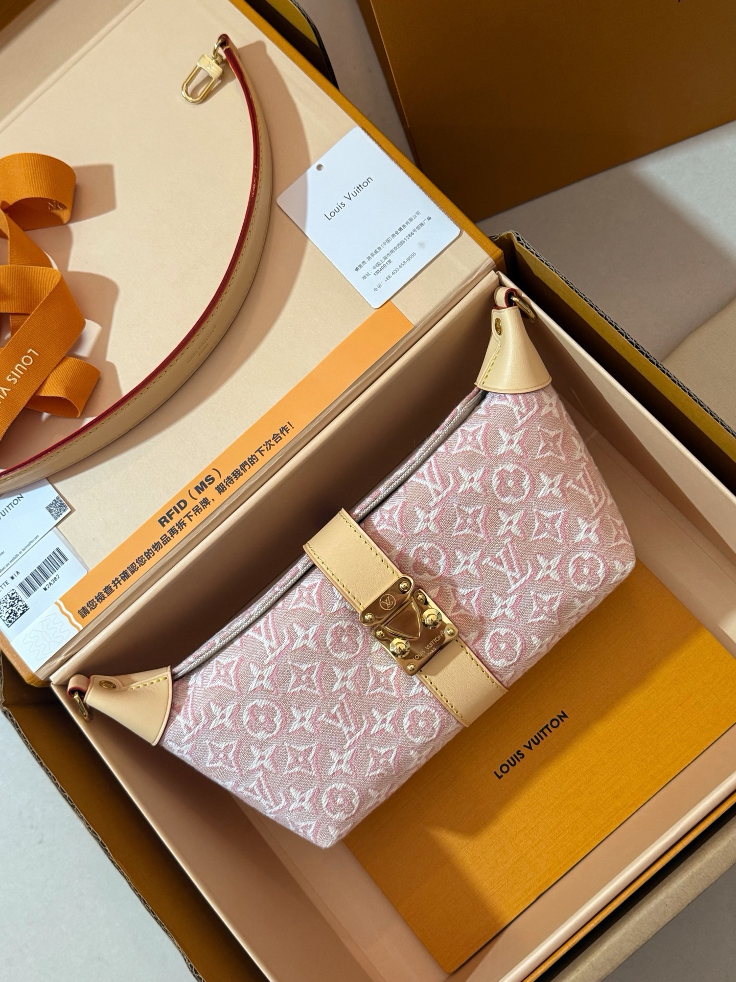Louis Vuitton Pochette Mia bag pink monogram jacquard fabric