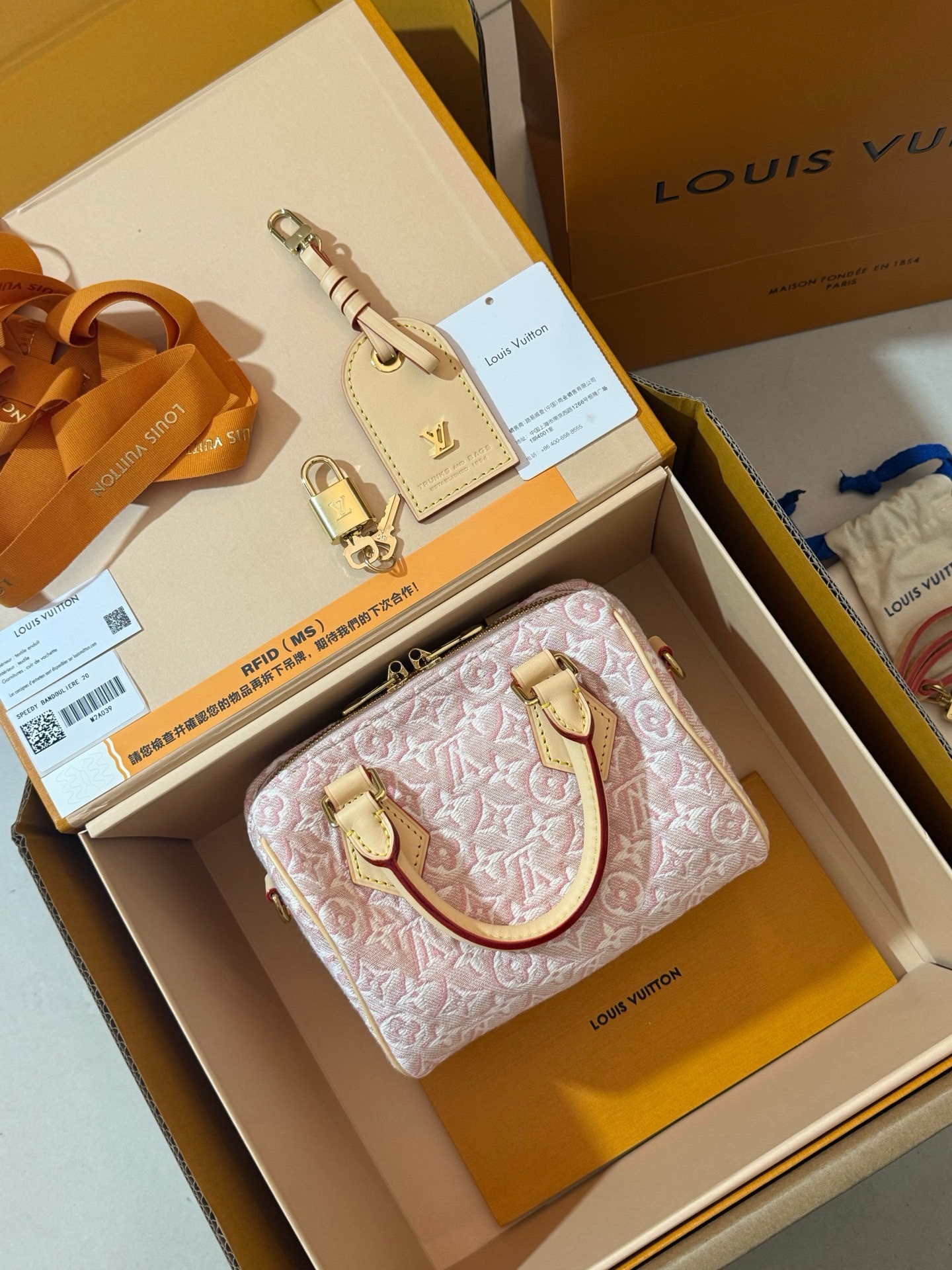 Louis Vuitton Speedy Bandoulière 20 M2A039 pink monogram jacquard fabric handbag