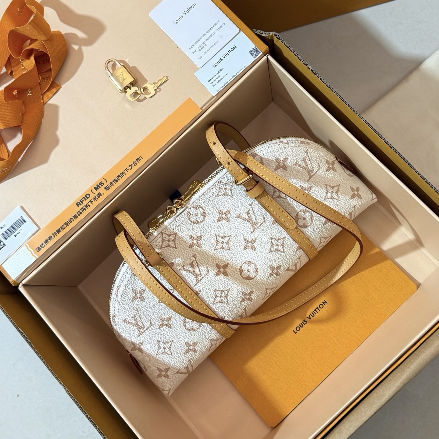 Louis Vuitton Squire East‑West M2A457 monogram dune canvas handbag